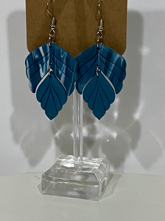 Blue and white feathered dangle earrings